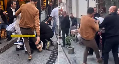 Esnaf, yere yatırdığı kişiyi acımasızca dövdü